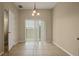 Bright dining area with tile floors and sliding glass door leading to patio at 889 Park Grove Ct, Orlando, FL 32828