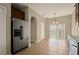Kitchen with stainless steel refrigerator and access to backyard at 889 Park Grove Ct, Orlando, FL 32828