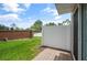 Small, private backyard with brick wall and patio at 889 Park Grove Ct, Orlando, FL 32828