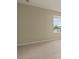 Simple carpeted bedroom with a window and neutral-colored walls at 889 Park Grove Ct, Orlando, FL 32828
