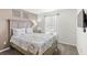 Bedroom with a queen-size bed and floral bedding at 2015 Majorca Drive, Kissimmee, FL 34747