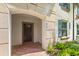 Inviting townhouse entryway with a dark brown door and brick walkway at 2015 Majorca Drive, Kissimmee, FL 34747