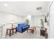 Cozy loft area with a blue sofa and two end tables at 2015 Majorca Drive, Kissimmee, FL 34747
