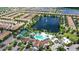 Community overview featuring pool, lake, and homes at 2015 Majorca Drive, Kissimmee, FL 34747