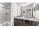 Bathroom with double vanity and a large walk-in shower at 2015 Majorca Drive, Kissimmee, FL 34747