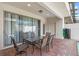 Outdoor patio with table and chairs, perfect for relaxing and entertaining at 2015 Majorca Drive, Kissimmee, FL 34747