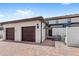 Two-car garage with brick paver driveway and nicely landscaped yard at 2015 Majorca Drive, Kissimmee, FL 34747