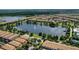 Community features a lake with fountain and homes at 2015 Majorca Drive, Kissimmee, FL 34747