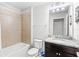 Clean bathroom with tub, shower, and granite countertop at 2015 Majorca Drive, Kissimmee, FL 34747