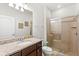 Clean bathroom with granite countertop, shower and a large mirror at 2015 Majorca Drive, Kissimmee, FL 34747