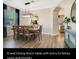 Spacious dining room with an 8-seat table, offering access to the kitchen and Gathering room at 2609 Archfeld Blvd, Kissimmee, FL 34747