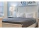 Bedroom with a queen bed and coastal-themed decor at 4637 Target Blvd, Kissimmee, FL 34746