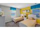 Twin bedroom with yellow and white bedding and Minions wall art at 4637 Target Blvd, Kissimmee, FL 34746