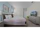 Main bedroom with a large bed and a dresser at 4637 Target Blvd, Kissimmee, FL 34746