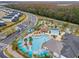 Community pool with lazy river, playground and plenty of lounge chairs at 4637 Target Blvd, Kissimmee, FL 34746