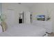 Bright bedroom with ensuite bathroom and a TV at 4637 Target Blvd, Kissimmee, FL 34746