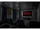 Home theater room with large screen TV and seating at 4637 Target Blvd, Kissimmee, FL 34746