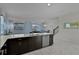 Open concept kitchen with island and stainless steel appliances at 4637 Target Blvd, Kissimmee, FL 34746