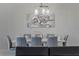 Modern dining room with white table and gray chairs at 4637 Target Blvd, Kissimmee, FL 34746