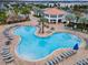 Large freeform community pool with surrounding patio and lounge chairs at 4637 Target Blvd, Kissimmee, FL 34746