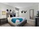 Mickey Mouse themed bedroom with a queen bed, nightstands, and a TV at 4637 Target Blvd, Kissimmee, FL 34746