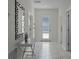Bright entryway with tile floors and a modern mirror at 4637 Target Blvd, Kissimmee, FL 34746