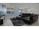Living room with sectional sofa and large area rug at 4637 Target Blvd, Kissimmee, FL 34746