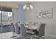 Dining room with table and seating for eight, view of backyard pool at 4637 Target Blvd, Kissimmee, FL 34746