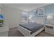 Bedroom with queen bed, coastal decor, and TV at 4637 Target Blvd, Kissimmee, FL 34746
