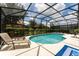 Relaxing kidney-shaped pool with screened enclosure at 5237 Oakbourne Ave, Davenport, FL 33837