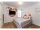 Charming bedroom with a Mickey Mouse-themed wall at 5237 Oakbourne Ave, Davenport, FL 33837