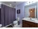 Clean bathroom with shower/tub combo, vanity, and toilet at 5237 Oakbourne Ave, Davenport, FL 33837