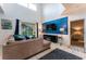 Living room with sectional sofa, fireplace, and pool view at 5237 Oakbourne Ave, Davenport, FL 33837