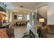 Open concept dining room with a large table and view into the living room at 5237 Oakbourne Ave, Davenport, FL 33837