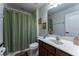 Well-lit bathroom with shower/tub, vanity, and toilet at 5237 Oakbourne Ave, Davenport, FL 33837
