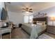 Spacious main bedroom with a king-size bed and seating area at 5237 Oakbourne Ave, Davenport, FL 33837