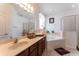 Bathroom with double vanity, soaking tub, and shower at 5237 Oakbourne Ave, Davenport, FL 33837
