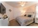 Bright bedroom featuring a king-size bed and calming decor at 5237 Oakbourne Ave, Davenport, FL 33837