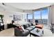 Spacious bedroom with city view and comfortable seating area at 155 S Court Ave # 2503, Orlando, FL 32801