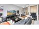 Living room features comfortable seating and large flat-screen TV at 155 S Court Ave # 2503, Orlando, FL 32801