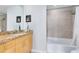 Modern bathroom with granite vanity and bathtub/shower combo at 155 S Court Ave # 2503, Orlando, FL 32801