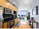 Open kitchen with modern appliances and city views at 155 S Court Ave # 2503, Orlando, FL 32801