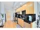 Modern condo kitchen features stainless steel appliances and dark countertops at 155 S Court Ave # 2503, Orlando, FL 32801
