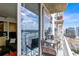Relaxing balcony with outdoor furniture and city views at 155 S Court Ave # 2503, Orlando, FL 32801