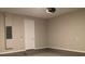 Attached garage with painted walls and light grey flooring at 8073 Cherrystone St, Leesburg, FL 34748