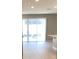 Bright and airy living room with sliding glass doors at 8073 Cherrystone St, Leesburg, FL 34748