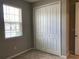 Bedroom with neutral walls, carpet flooring, and a large closet at 8073 Cherrystone St, Leesburg, FL 34748