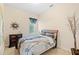 Guest bedroom with a full bed and decorative wall art at 25515 Hawks Run Ln, Sorrento, FL 32776