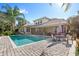 Inviting pool area with patio furniture and a brick deck at 25515 Hawks Run Ln, Sorrento, FL 32776
