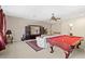 Spacious game room with pool table and comfortable seating at 25515 Hawks Run Ln, Sorrento, FL 32776